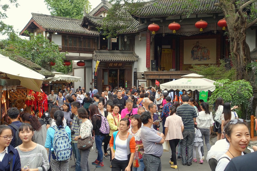Lively street in Chengdu where a local guide could meet you